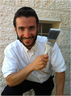 Nachum Shore, painting contractor holding Purdy paintbrush