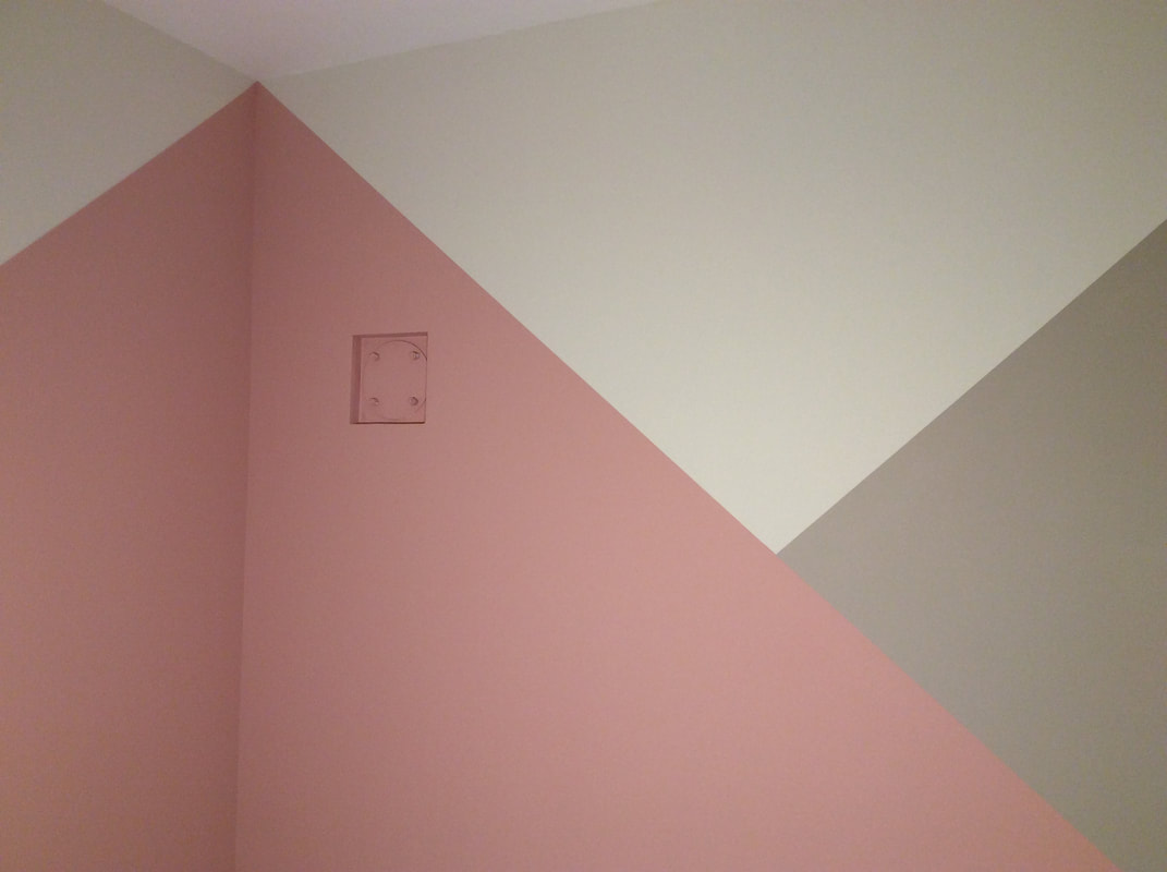 Geometric design creating modern wall effect, painted with Benjamin Moore in Neve Hapisgah, J-m