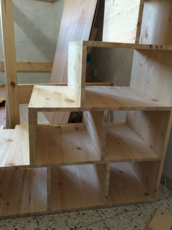 Cubbies / stairs, during the building stage of the bunkbed